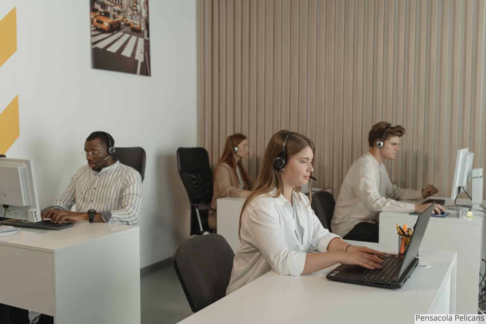 Four People Working in Call Center Office