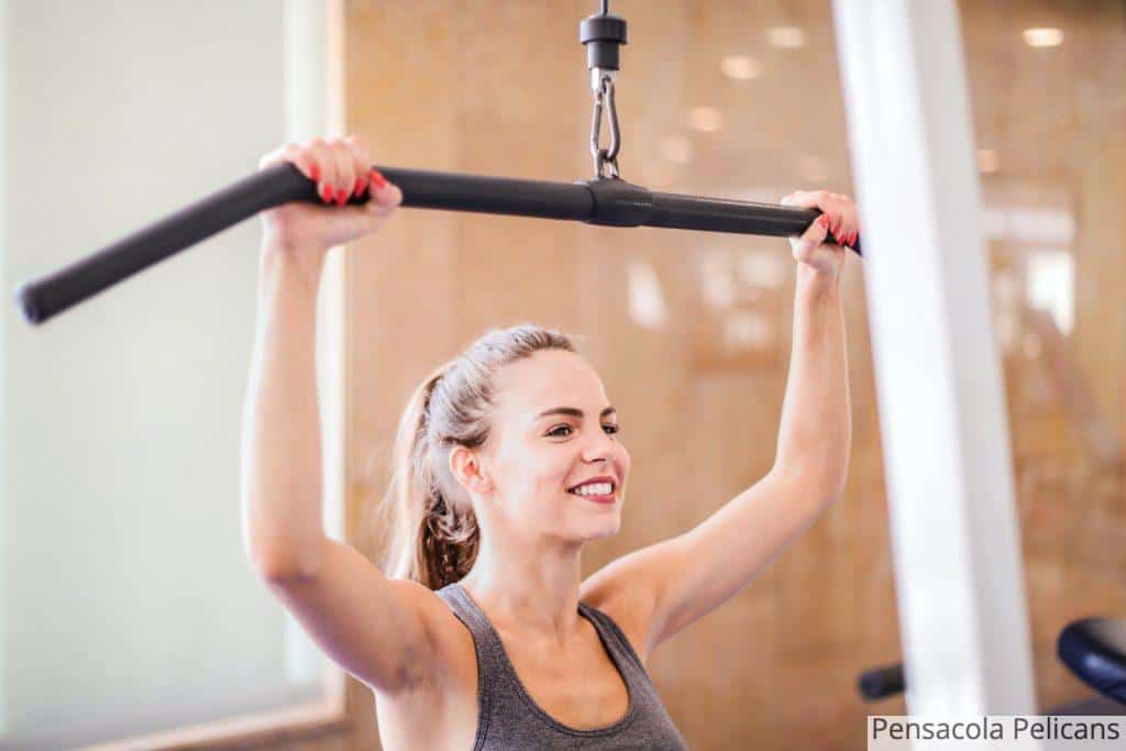 Photo Of Woman Using Gym Equipment