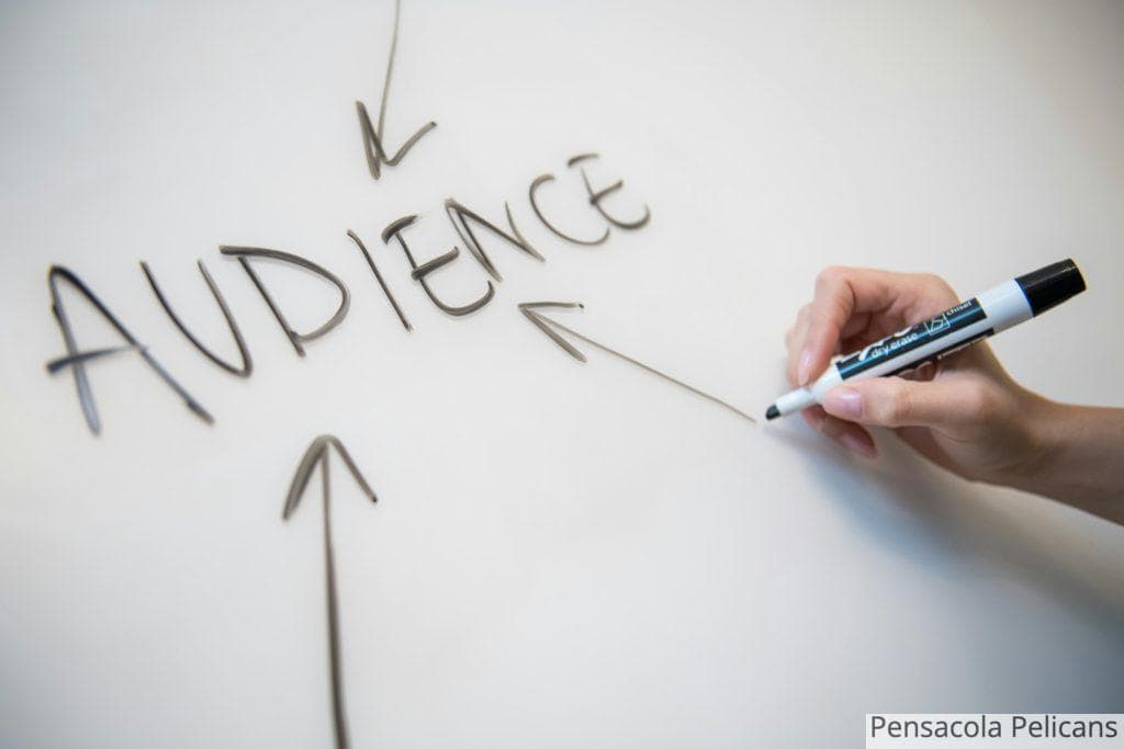 person writing on white paper